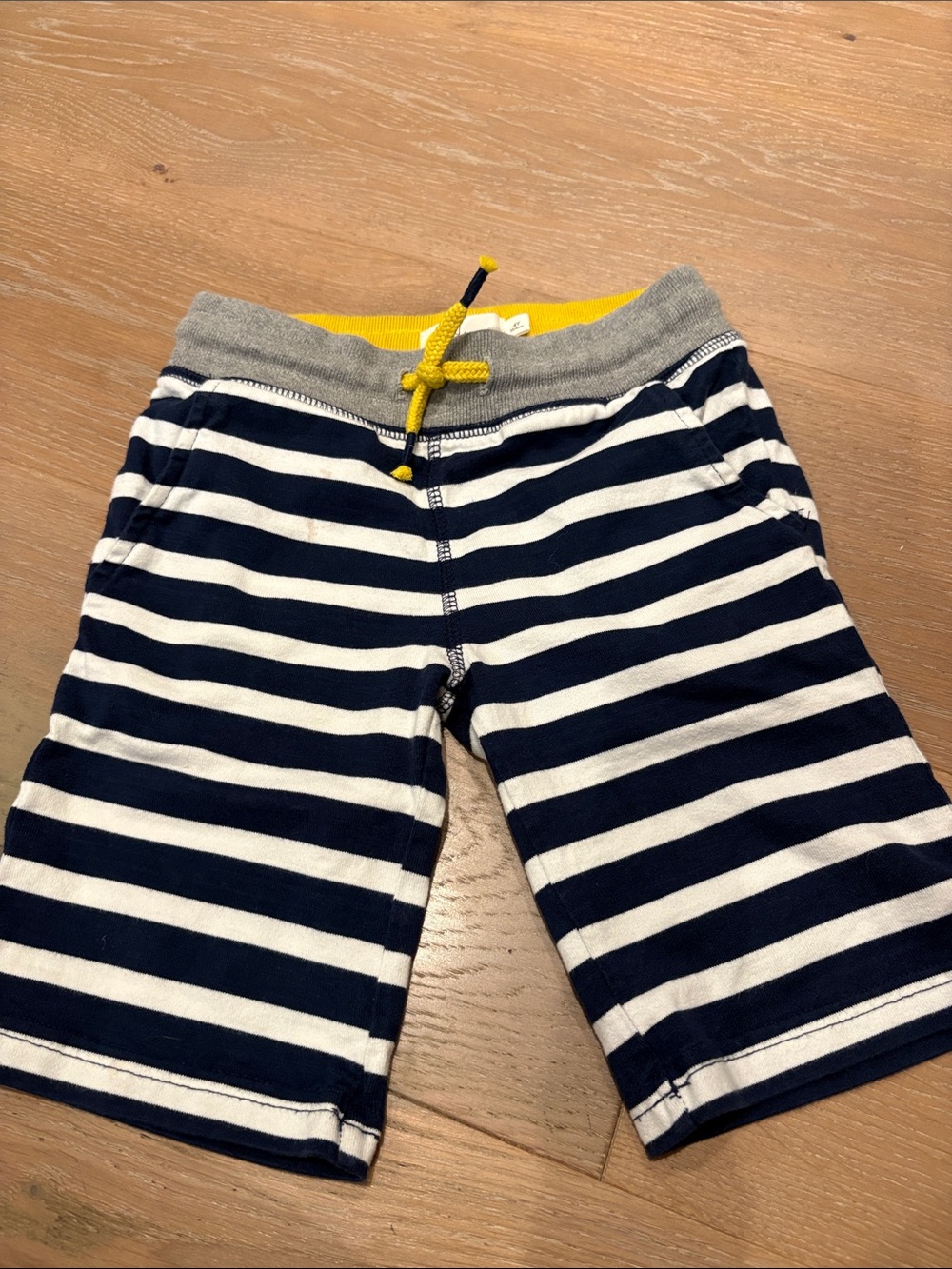 Mini Boden Size 4Y Navy & White Striped Shorts with Yellow Drawstring.